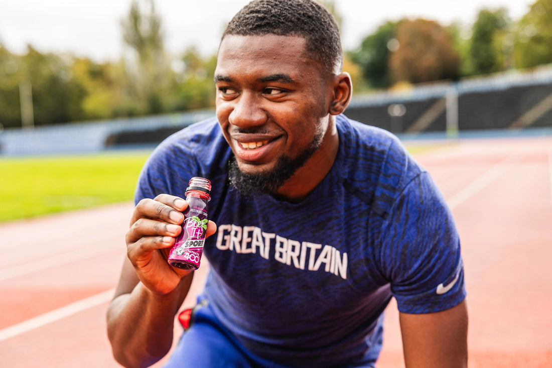 Athlete runner Jamal holding and drinking Beet It Sport nitrate shot before training, highlighting beet juice for runners and sports performance benefits