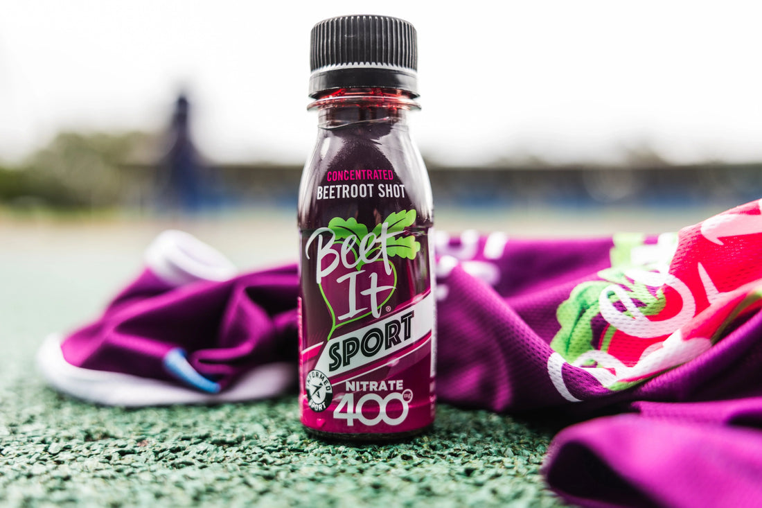 Beet It Sport Nitrate 400 Shot placed next to athletic gear, highlighting its role in enhancing athletic performance