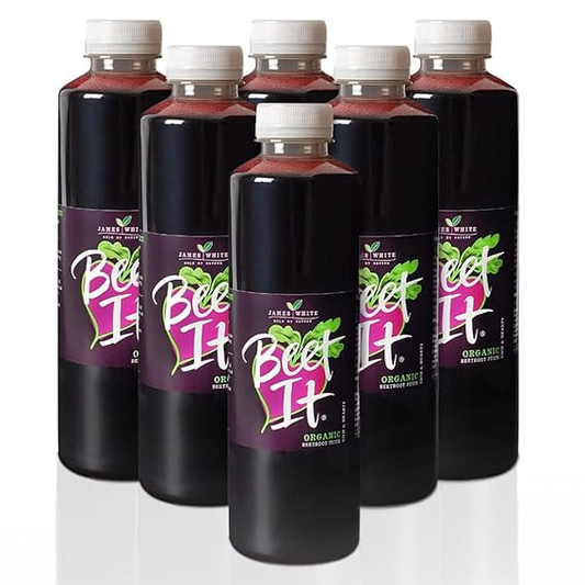 Pouring BEET IT Organic Beetroot Juice from a 25.4 fl oz bottle into small glasses to embrace daily wellness.