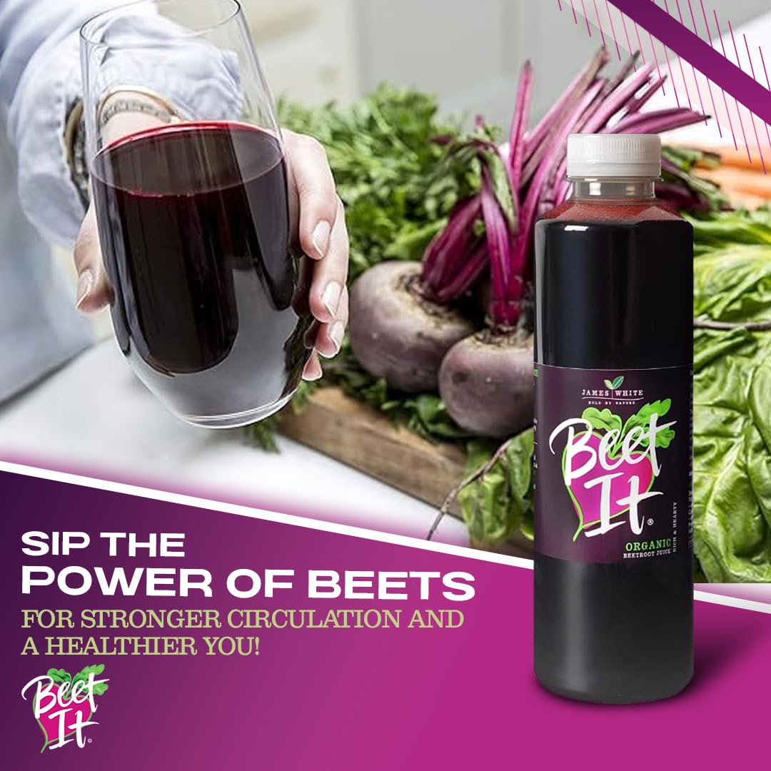 Person holding a glass of dark red Beet It juice next to fresh organic whole beets for improved circulation.